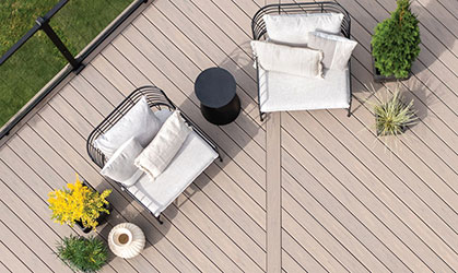 An overhead view of an outdoor deck with two chairs.